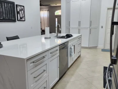 Kitchen Cabinets 9 Modern white kitchen with tall custom cabinets and quartz island.